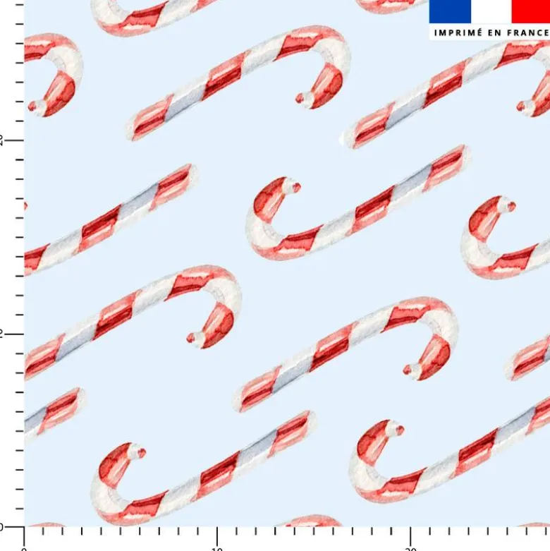 Grand sucre d'orge rouge et blanc - Fond bleu ciel