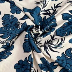 Popeline de viscose écrue motif fleurs et feuilles de monstera bleues