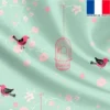 Satin vert d'eau motif fleur de cerisier rose et cage à oiseaux
