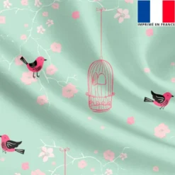 Satin vert d'eau motif fleur de cerisier rose et cage à oiseaux