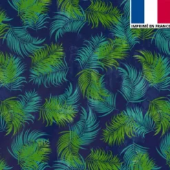 Tissu burlington bleu motif feuilles tropicales vertes