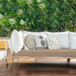 Tissu imperméable écru motif ananas tropical effet rotin