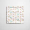 Tissu imperméable motif grands triangles pastel et paillettes