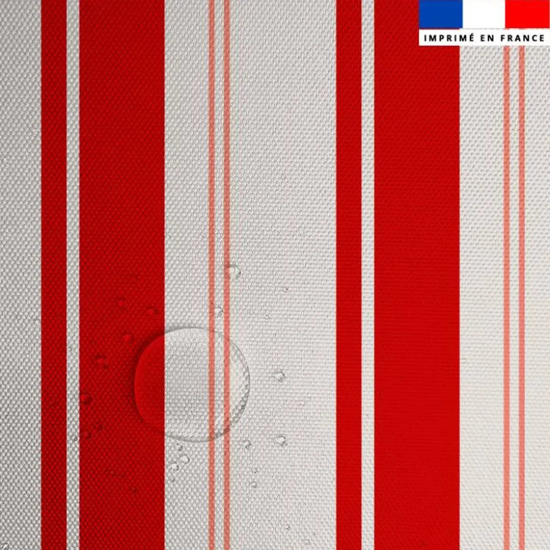 Tissu imperméable motif rayures verticales rouge et saumon