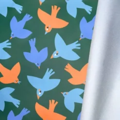 Tissu imperméable type ciré vert motif hirondelle