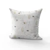 Tissu nid d'abeille motif fleur de cerisier rose et cage à oiseaux