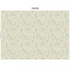 Tissu occultant grège motif silhouettes de feuilles vertes